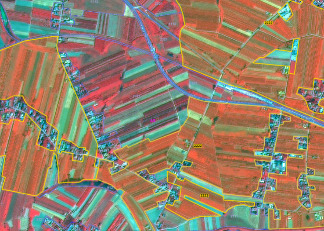 The image displays a false-colour infrared (FCIR) satellite view of an unspecified rural or semi-rural area, featuring a complex pattern of land cover. Agricultural fields are the dominant feature, rendered in various shades of red and green/turquoise, indicating different types or vigour of vegetation. Darker red hues signify higher vegetation activity. Numerous yellow lines delineate individual land parcels or field boundaries, some of which contain numeric identifiers such as '1118', '604', '1119', '605', '606', '607', and '608'. Linear blue features represent infrastructure, including a prominent multi-lane highway in the upper central part and smaller roads winding through the landscape. Clusters of white and light grey pixels indicate buildings and settlements, often adjacent to the agricultural fields. No scale bar, compass, or legend is present.