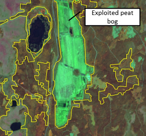 An infrared orthophoto displaying a landscape with distinct land cover features. The central, dominant feature is a large, bright green, rectangular area with a visible linear trench and parcel structure, explicitly labelled 'Exploited peat bog.' This area is delineated by a yellow polygon outline. To the left of the peat bog, there are two distinct dark blue water bodies (lakes) also outlined in yellow. The surrounding areas show a mix of reddish-brown and darker green hues, indicative of other land cover types such as forest or agricultural land, also delineated by yellow polygon outlines. The image background consists of infrared orthophotos, with imagery credit attributed to Lantmäteriet.